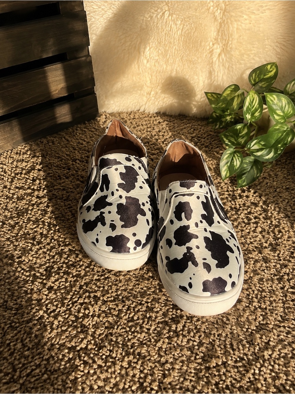 Women’s cow print slip on shoes